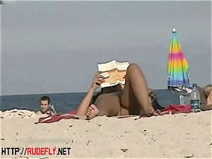 super-steamy stunners filmed lounging on a naturist beach